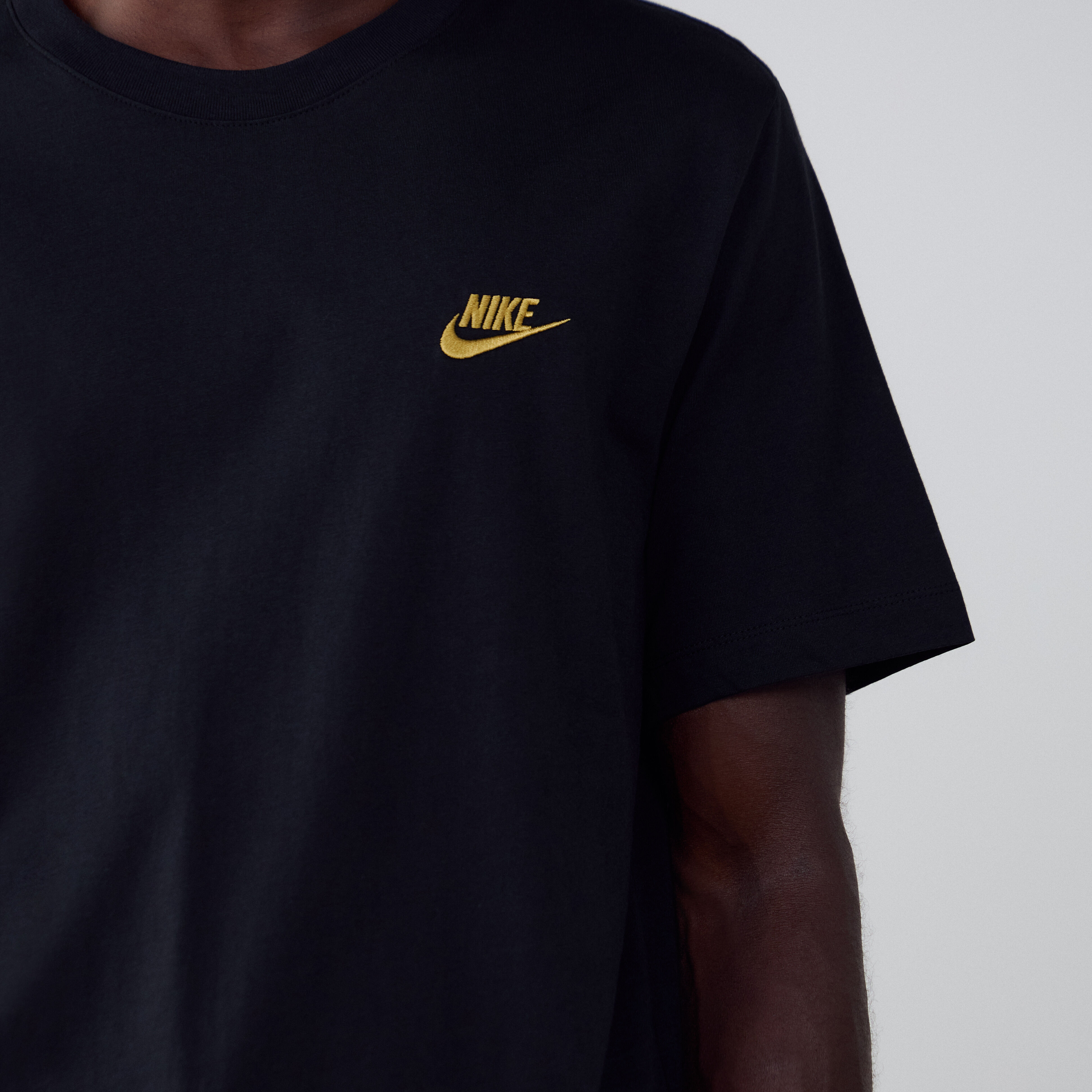 nike gold logo t shirt